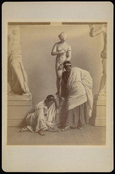 Two Male Students in Grecian Costume Before a Plaster Cast of Aphrodite in the Cast Room of the Pen... by Thomas Eakins